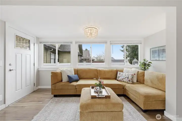 The light filled living room is cozy and roomy at the same time.