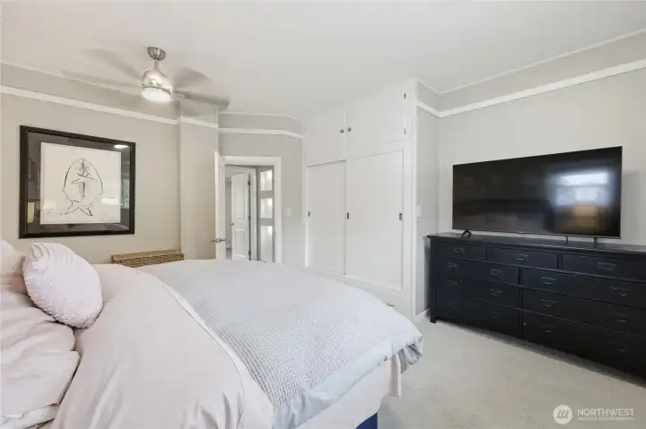 Another view of the primary bedroom with built in closet.