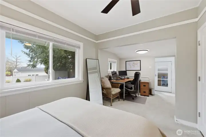 The 2nd bedroom extends into another room which is being used as an office.