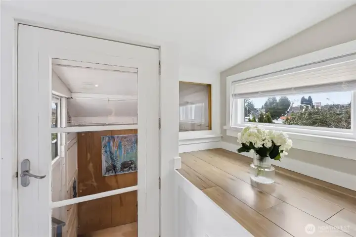 Beyond the music room is a doorway to the basement.