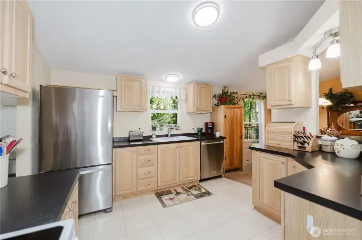 another kitchen view. Can you see the washer, dryer and door to the beautiful back deck? beyond the kitchen?