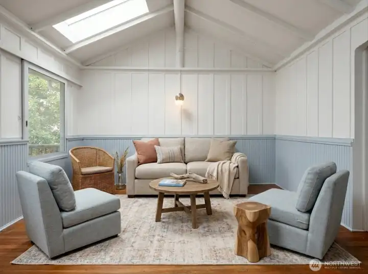 Virtually staged to show living room seating possibilities.  This is such a pretty room!