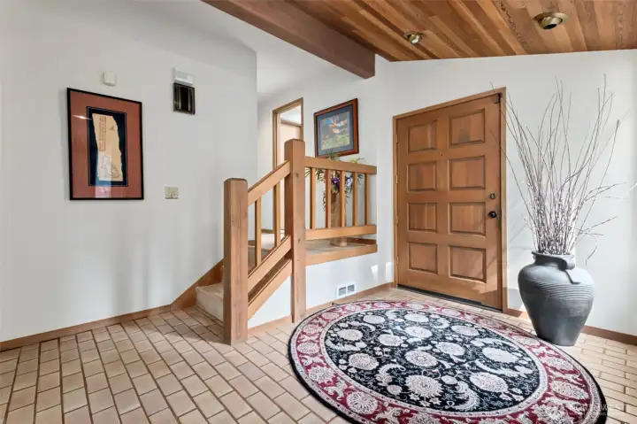 Front entry showing stairs to upper bedrooms/flex room.