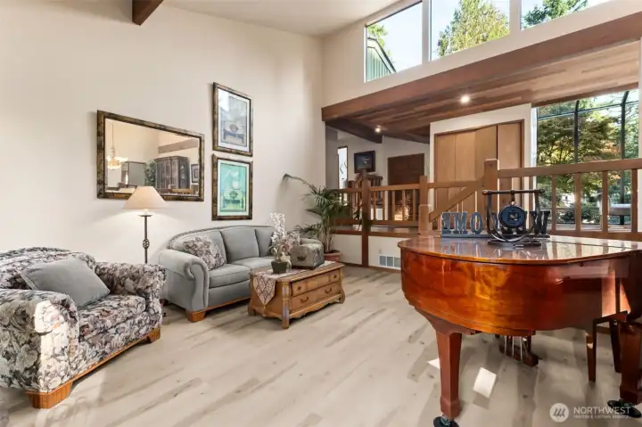 Windows in living room span both front and back sides of home providing morning and afternoon light.