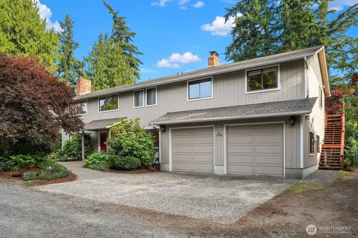 Attached 2-car garage with a stairway to the right leading up to the guest apartment.