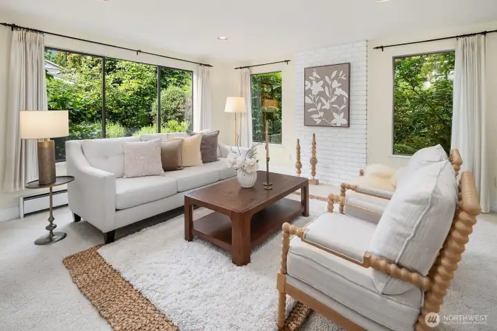 Expansive windows bring beautiful scenery into the living room.