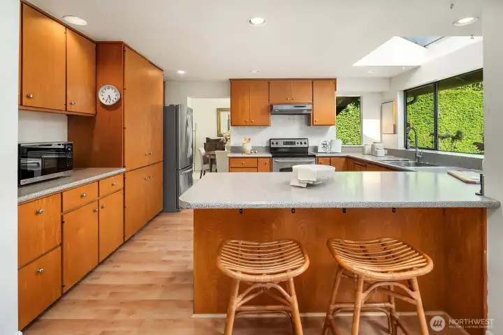 Cupboards galore, plus a peninsula with breakfast bar.