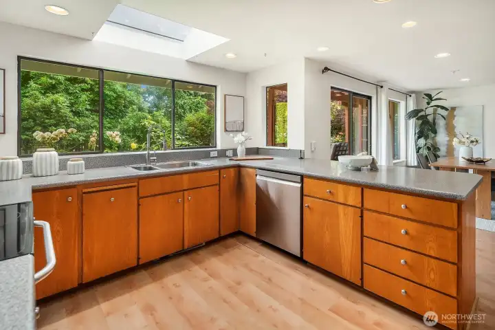 A skylight & backyard-facing window both bring in brilliant natural light.