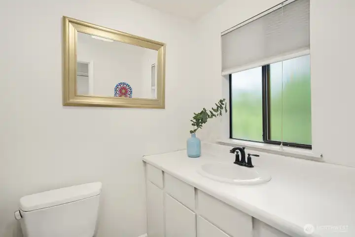 A powder room for guests completes the main level.