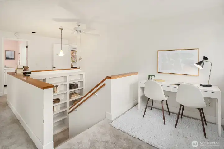 More custom shelving creates a fun library nook off the stairway.