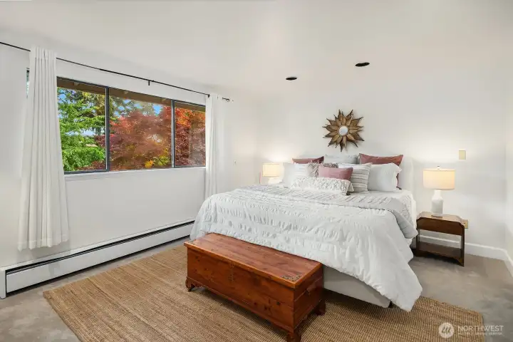 Your primary suite enjoys generous proportions & peaceful backyard views.