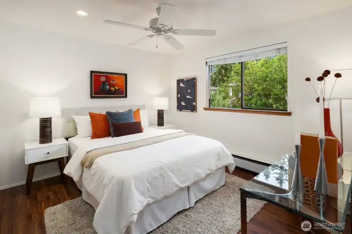 Bedroom with ceiling fan in the guest quarters.