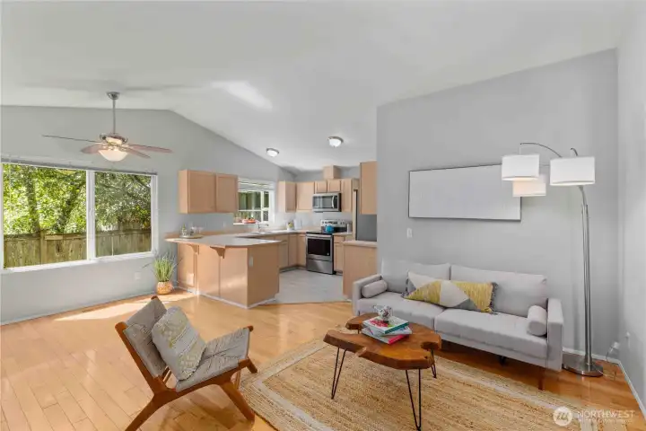 Living room with a woodburning fireplace and extra eating space!