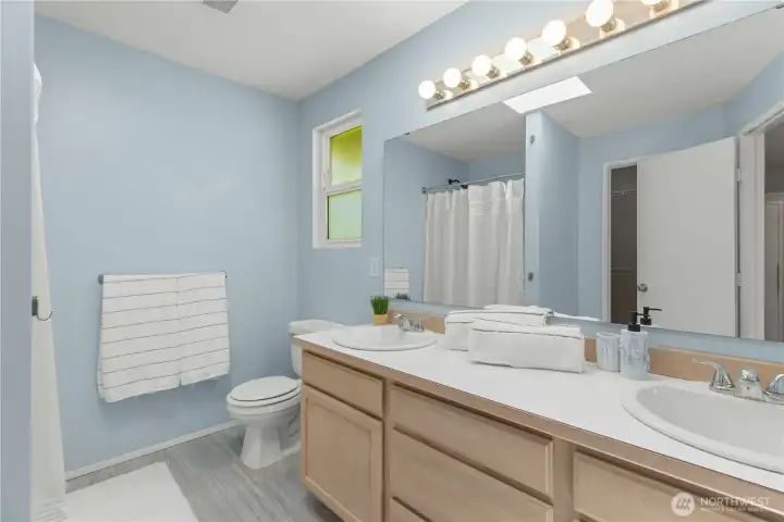 Roomy primary bath with an easy walk-in shower.