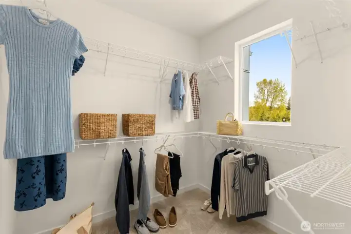 Primary suite Walk-in Closet. Photo is of model home of same floorplan. Color schemes and finishes will vary per plan. Primary suite Walk-in Closet. Photo is of model home of same floorplan. Color schemes and finishes will vary per plan.