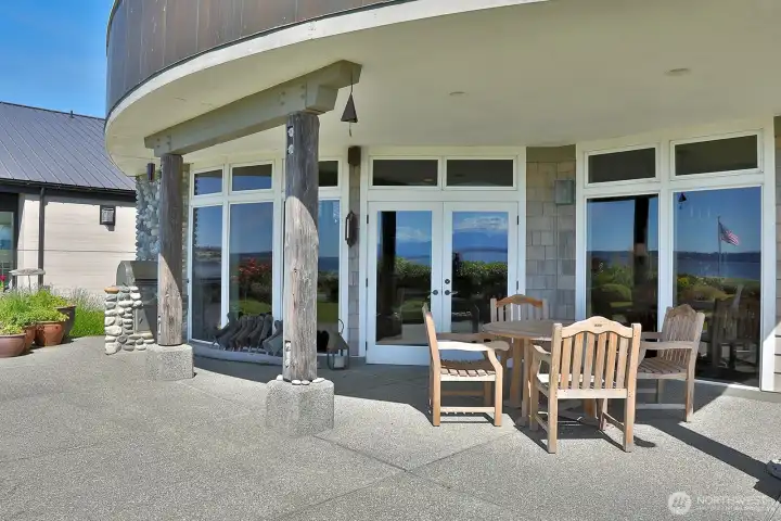A spacious patio that is partly covered...the overhang provides shading for the house to keep downstairs cool during the summer. A spacious patio that is partly covered...the overhang provides shading for the house to keep downstairs cool during the summer.