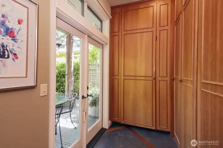 Laundry room at the entry is also a storage space. Laundry room at the entry is also a storage space.