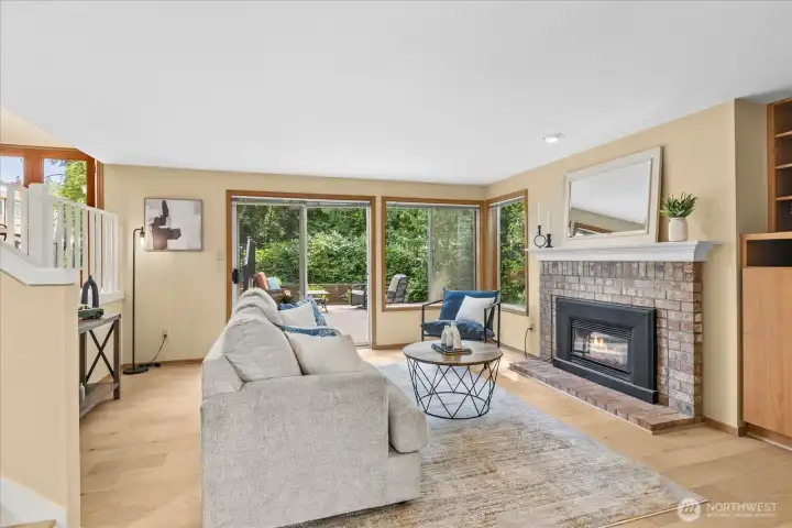 Step downstairs to the family room, featuring a cozy gas fireplace and a second set of french doors opening to the deck outside.