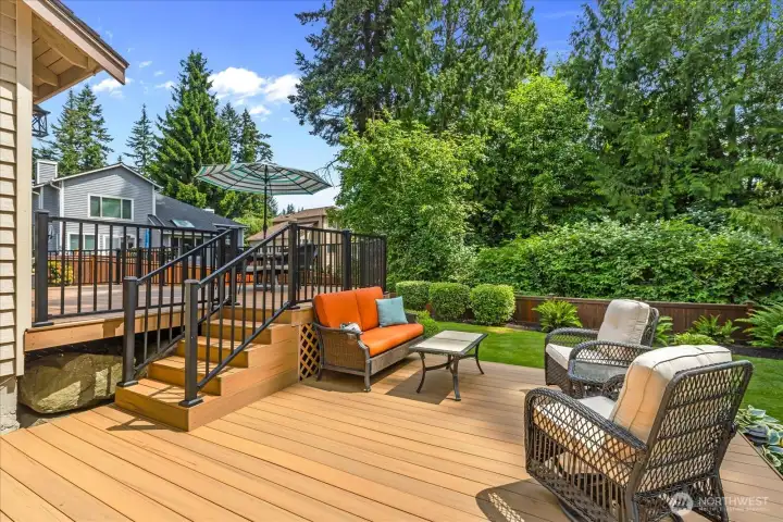 A 2-level, composite, oversized deck extends your living room outdoors.