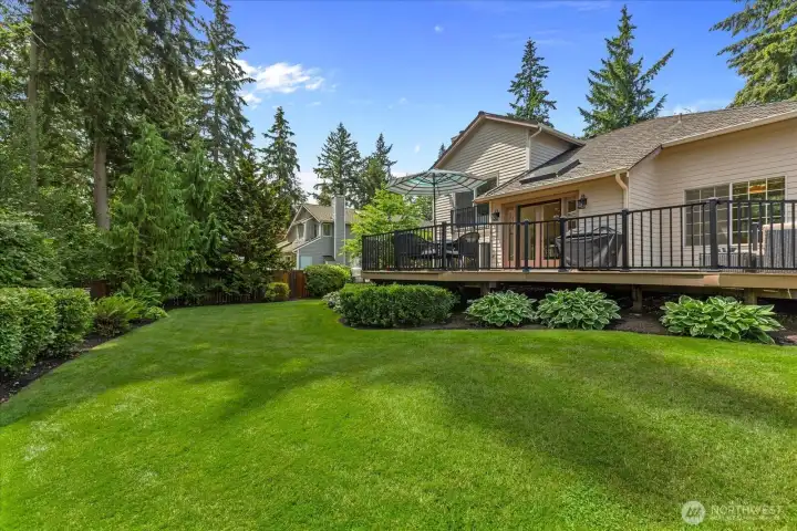 Enjoy the beauty of the meticulously landscaped backyard.