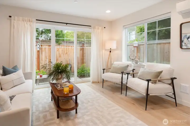 The Living room has southwestern light, great air flow with windows & sliders, and features AC as well. The Living room has southwestern light, great air flow with windows & sliders, and features AC as well.