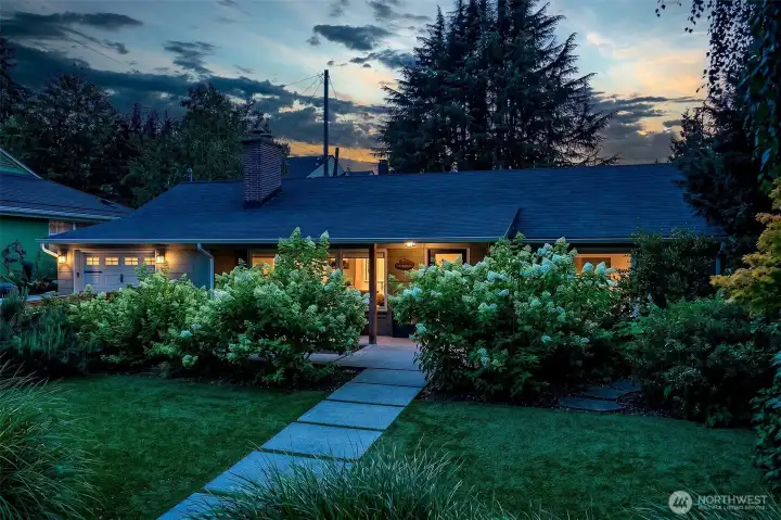 The home and InHarmony-designed landscape were conceived together, creating a private setting with mature trees, layered plantings and integrated lighting. The home and InHarmony-designed landscape were conceived together, creating a private setting with mature trees, layered plantings and integrated lighting.
