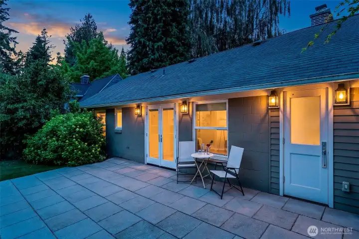 At twilight, the terrace and garden become an inviting outdoor room, connected directly to the kitchen and dining area. At twilight, the terrace and garden become an inviting outdoor room, connected directly to the kitchen and dining area.