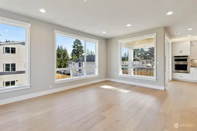 Main floor living room big windows and covered deck