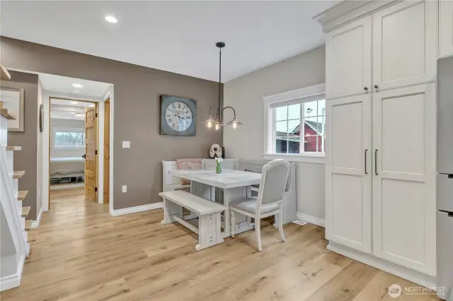 Dining Area looking towards the master bedroom. Kitchen table and benches do not convey with home