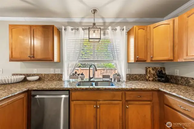 Granite countertops and stainless-steel appliances.