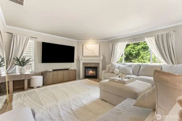 Main level living room with gas fireplace.