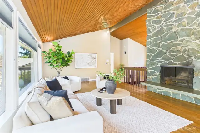 Vaulted ceiling with fireplace in living room