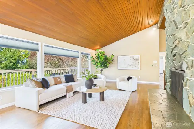 Vaulted ceiling with double pane big windows in living room