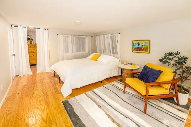 Functioning as a true fourth bedroom, this light-filled lower-level suite offers guests a private haven with direct bathroom access via the adjacent utility room. Sequestered from the main living areas, it’s ideal for early risers, night owls, or anyone craving a little quiet within a group stay.