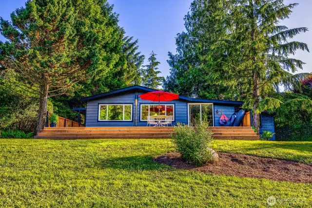 One last glance before the trail bends to the river: windows aglow, umbrella up, and cedar siding tucked into towering trees. Whether you’re a guest leaving after a magical stay or an owner heading down for a morning cast, River House Retreat stays with you—even after you step away.