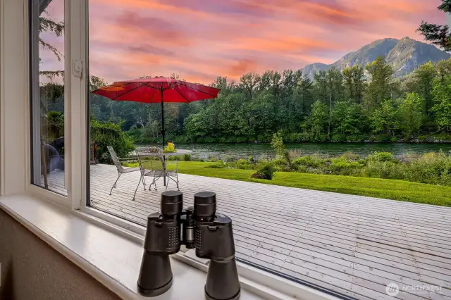 Welcome to River House Retreat—your front-row seat to Big Bend’s iconic Cable Hole on the Skykomish River. From this cedar-wrapped half-acre in Gold Bar, WA, watch eagles dive at dawn, mountains glow at dusk, and the rhythm of river life unfold just beyond your wraparound deck. Whether you’re savoring the view through binoculars or sharing stories over breakfast alfresco, this is where nature, nostalgia, and income potential converge—just an hour from Seattle.