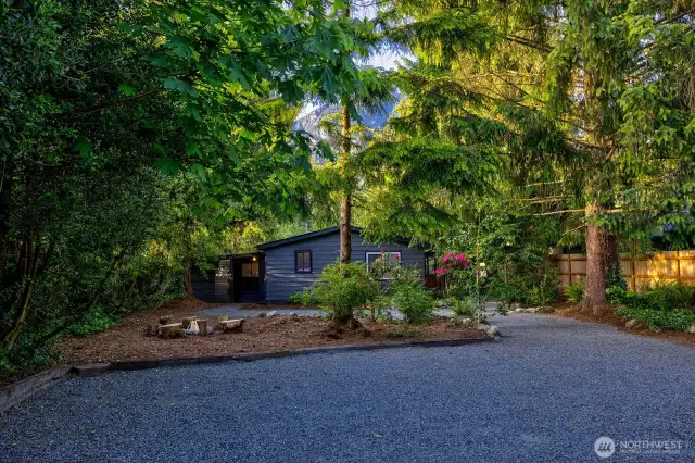 With space for 6+ vehicles—including boats, trailers, or an RV—this circular driveway makes arrival easy and stress-free for group stays. Shaded by evergreens and bordered by native plantings, it offers both practicality and a warm woodland welcome.