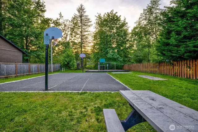 Big Bend’s private HOA includes three distinct riverfront parks—each with its own mood, each just steps from your door. Shown here is Park 2, home to a full sport court, picnic areas, swings, and a vintage merry-go-round where kids (and grownups) spin beneath the trees. Prefer a quiet float or casting a line? Head to Fisherman’s Park—an owner favorite—for solitude and prime access to the Cable Hole. For sun and sand, Park 1 delivers with a beach at the confluence of Proctor Creek and the Skykomish. In Big Bend, outdoor living isn’t just a feature—it’s a community amenity.