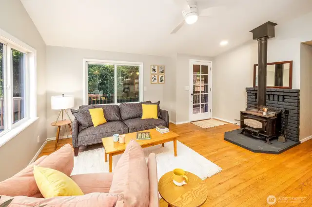 Step inside and feel it immediately: golden oak floors underfoot, the scent of woodsmoke curling from the Pine Ridge fireplace, and windows that frame forest and river like living art. This is more than arrival—it’s a return to what matters.