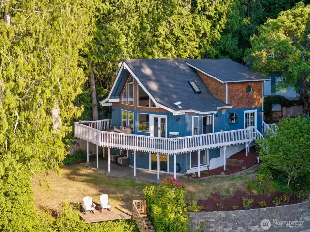 Get a full view of Whiteman Cove from this wraparound Trex deck porch!
