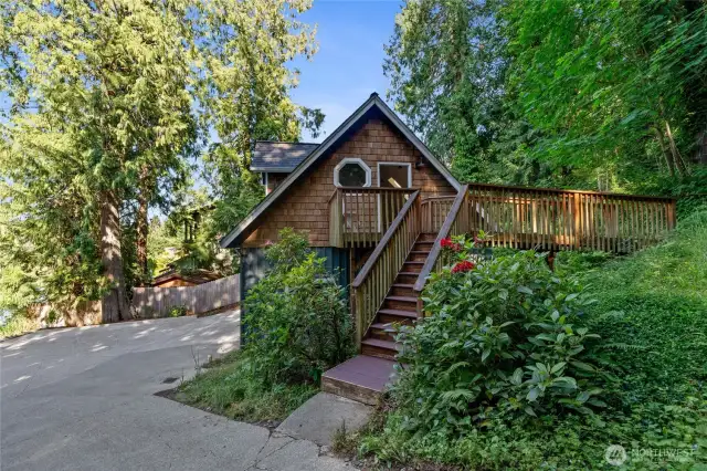 Above the garage, with a private separate entrance, awaits this charming cottage-style retreat.