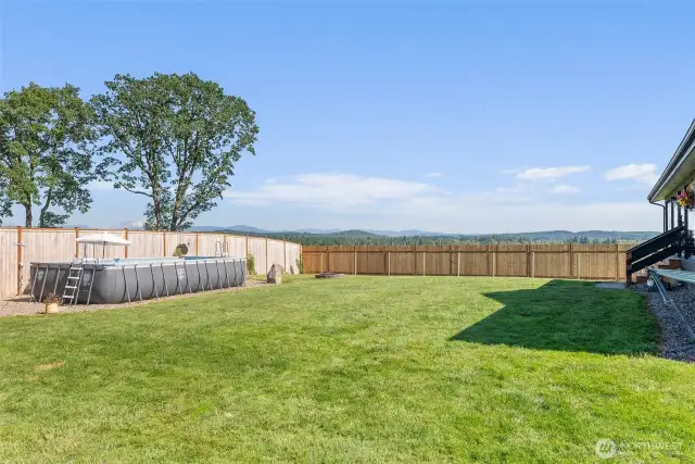 Privacy Fenced back yard with pool.