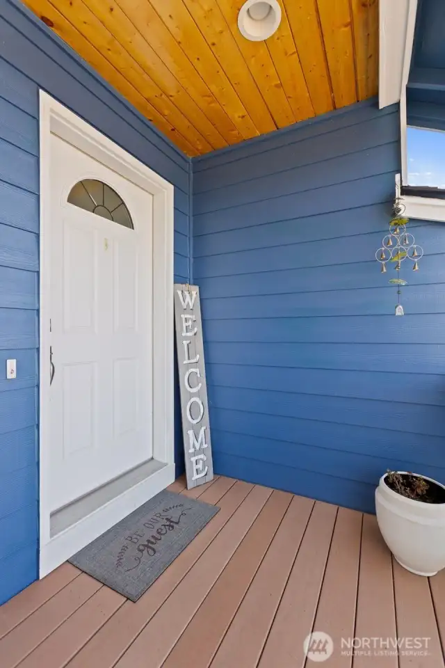 Note the tongue and groove cedar ceiling on the front deck.