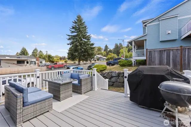 New composite/trex deck on the back patio along with new railings.