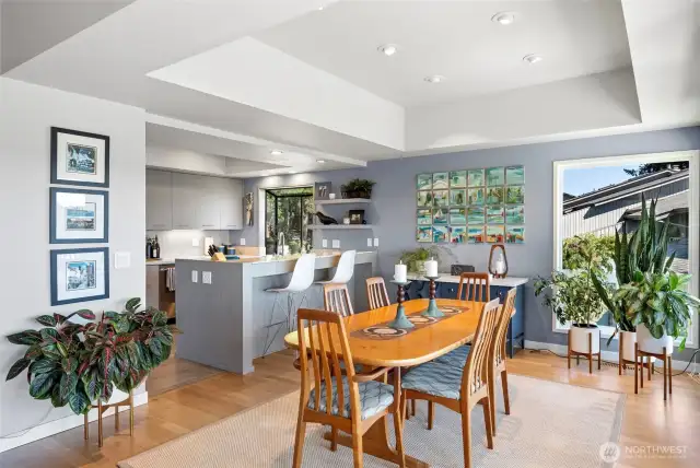 Dining room open to the kitchen; ideal for sit-down meals or casual buffets.