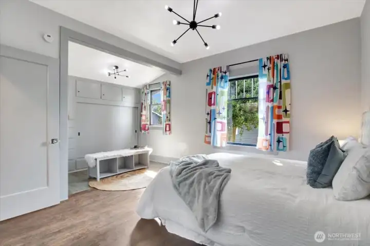 Large alcove off the primary bedroom has 2 closets and built in cabinets/drawers for storage.