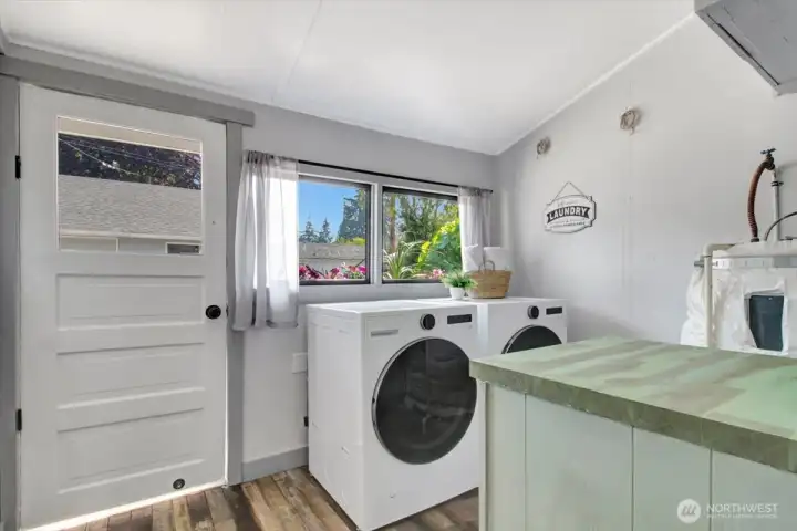 Large laundry room with new washer/dryer.