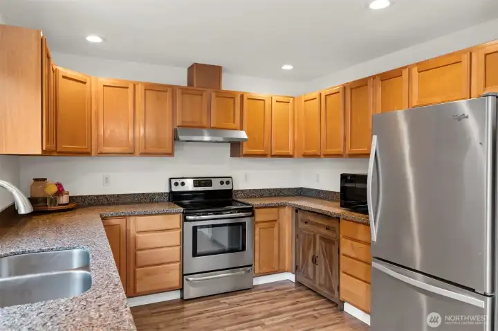 Kitchen has expansive cabinet space.
