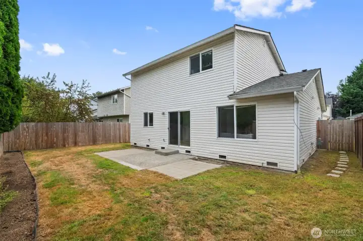 Fully fenced yard with patio