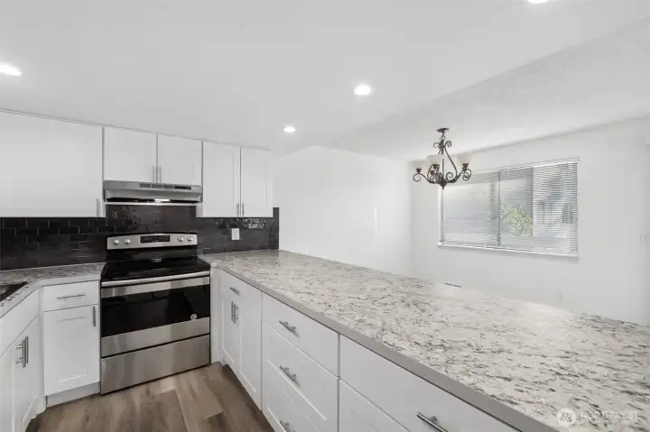 The chefs perspective. Enjoy ample cabinets and drawers, all newly installed.